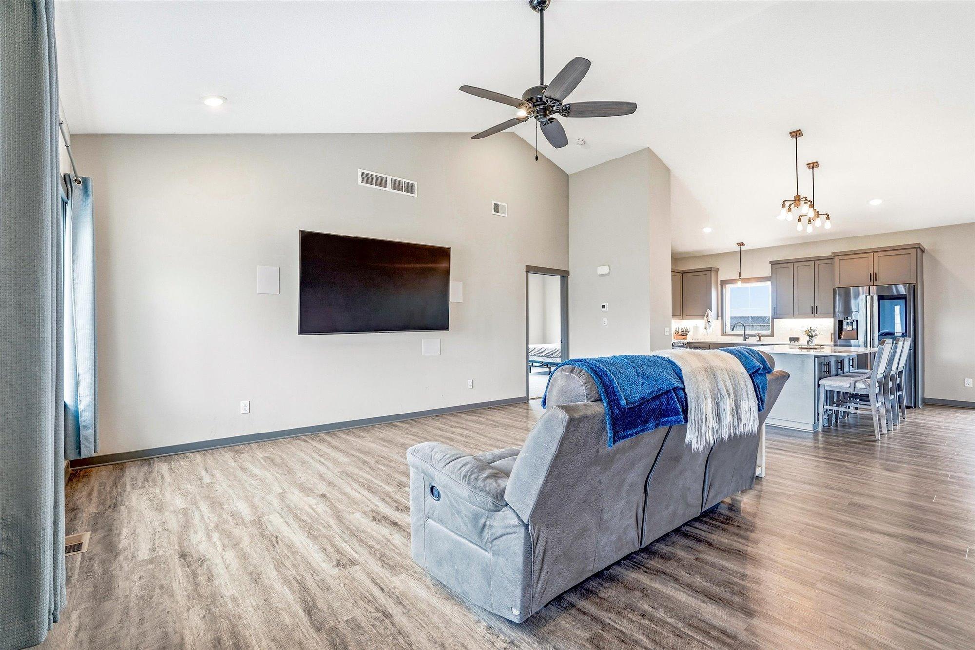 Spacious living room offers an open and airy layout perfect for entertaining and comfortable everyday living.