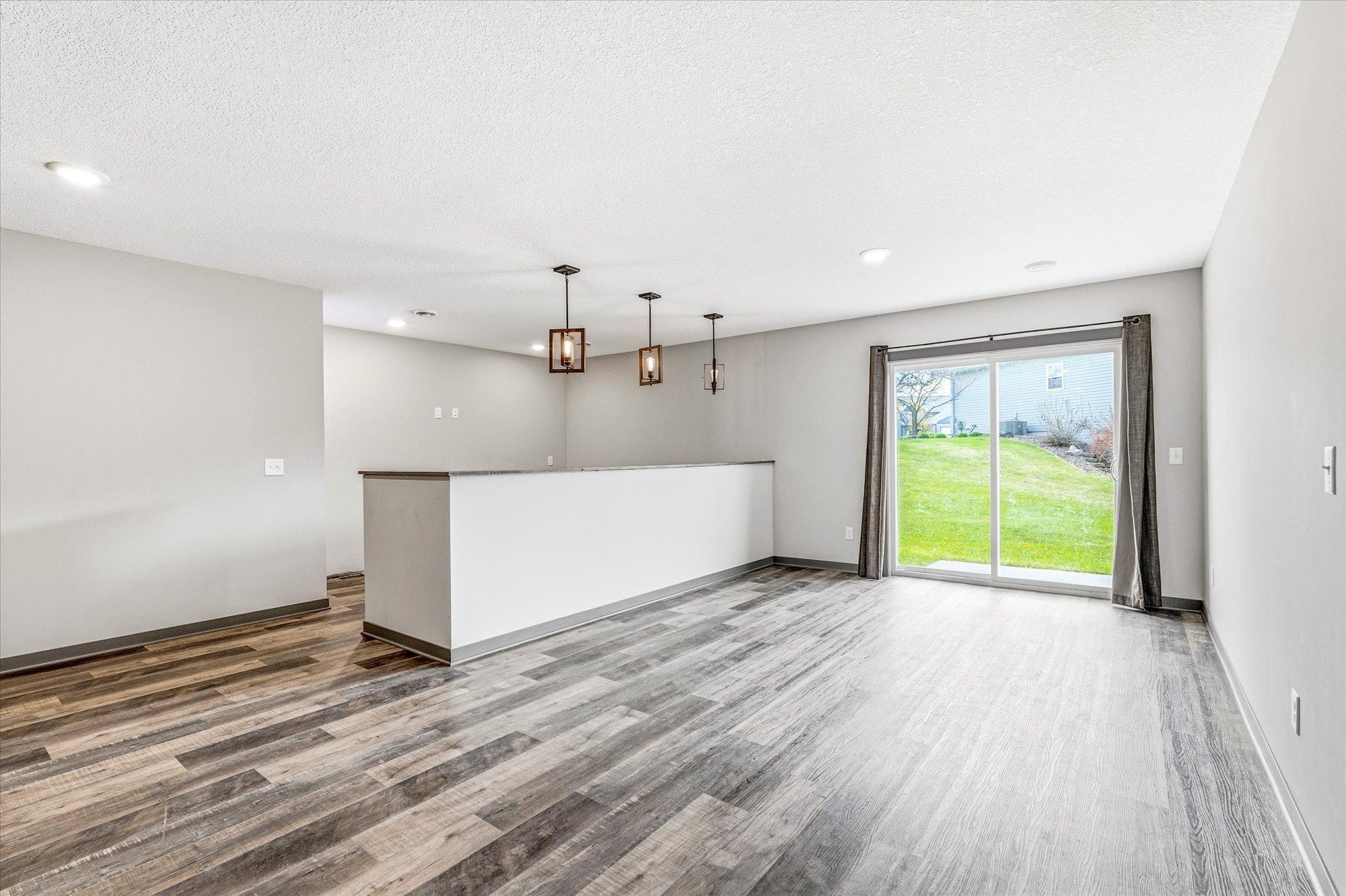 Expansive walkout lower level offers flexible living space with room for entertaining, hobbies, or a future game area.