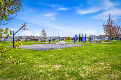 Neighborhood park nearby features playground equipment, basketball court, open green space, and gathering areas for outdoor enjoyment.