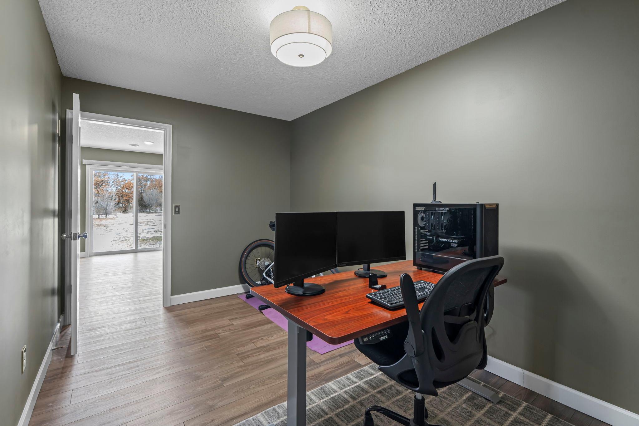The dedicated work space means you don't have to use one of the four bedrooms as an office, and looks right out to the patio door. This room could also be used as a home gym, toy room, hobby room, you choose!