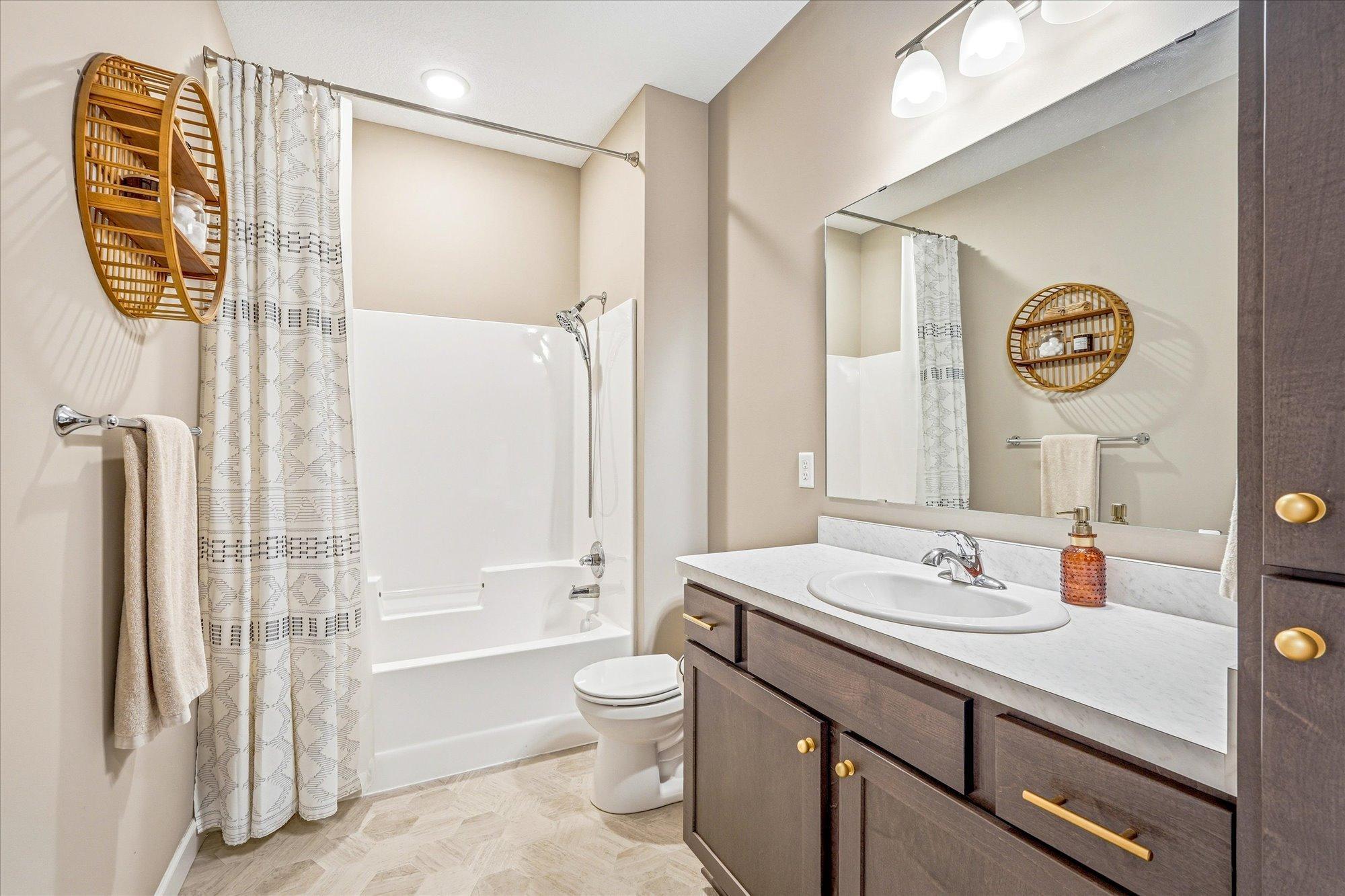The main level bathroom has soft close doors and drawers as well along with maintenance free LVT flooring.