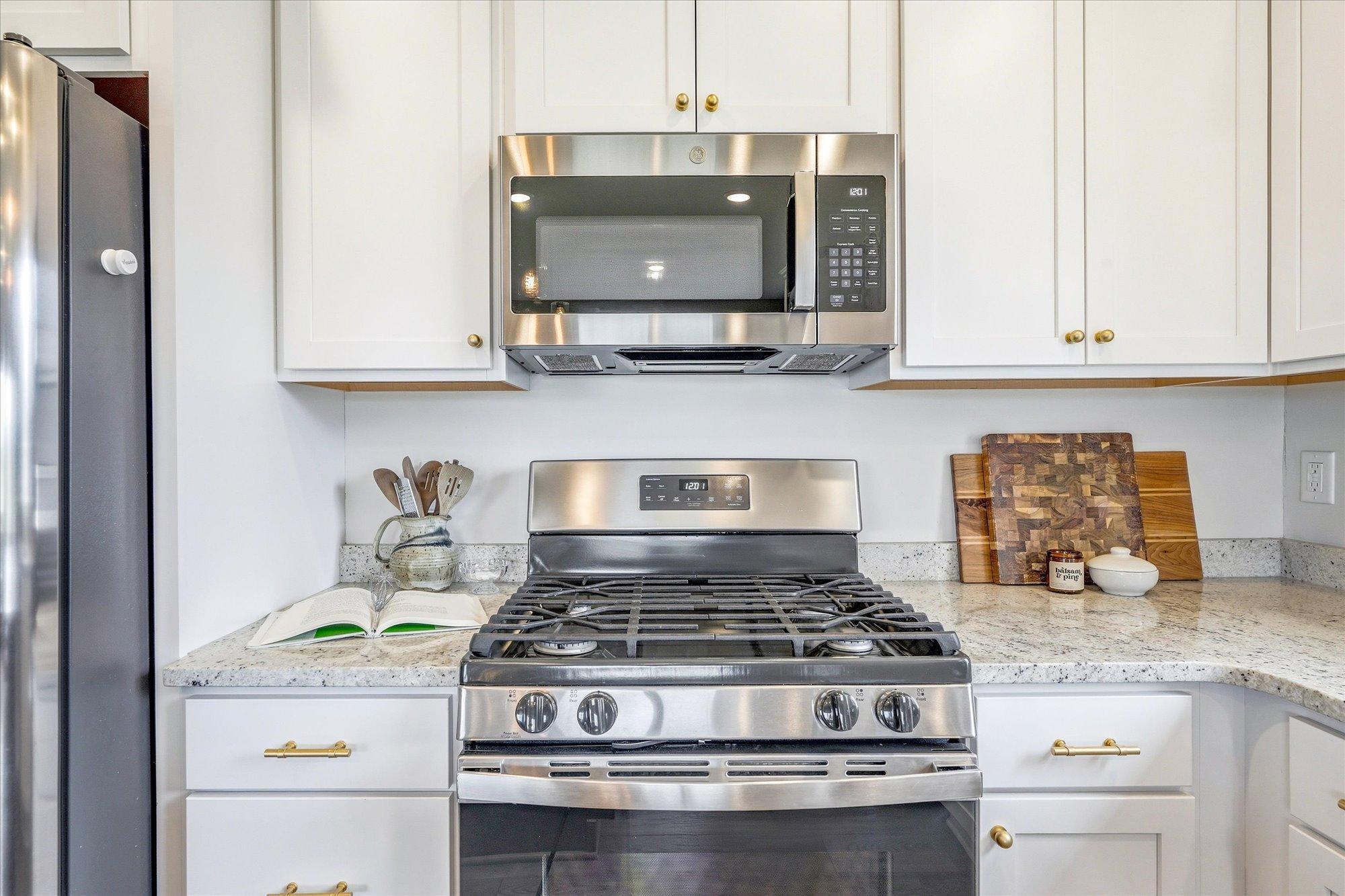 A gas stove, granite counter tops, and well cared for/clean appliances are ready to prep and cook your favorite dish.