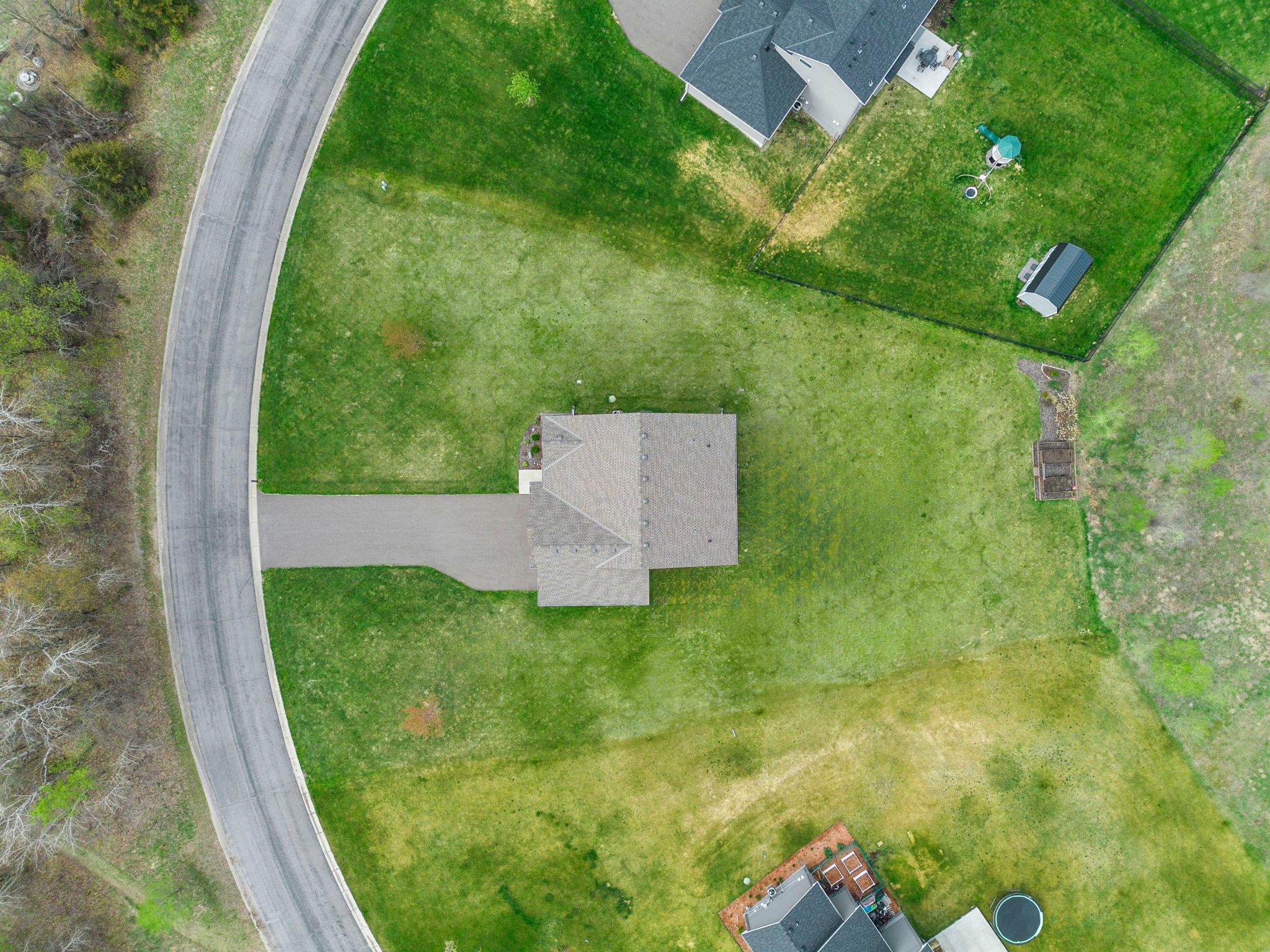 The well maintained yard is already starting to green in a spring view of this home.