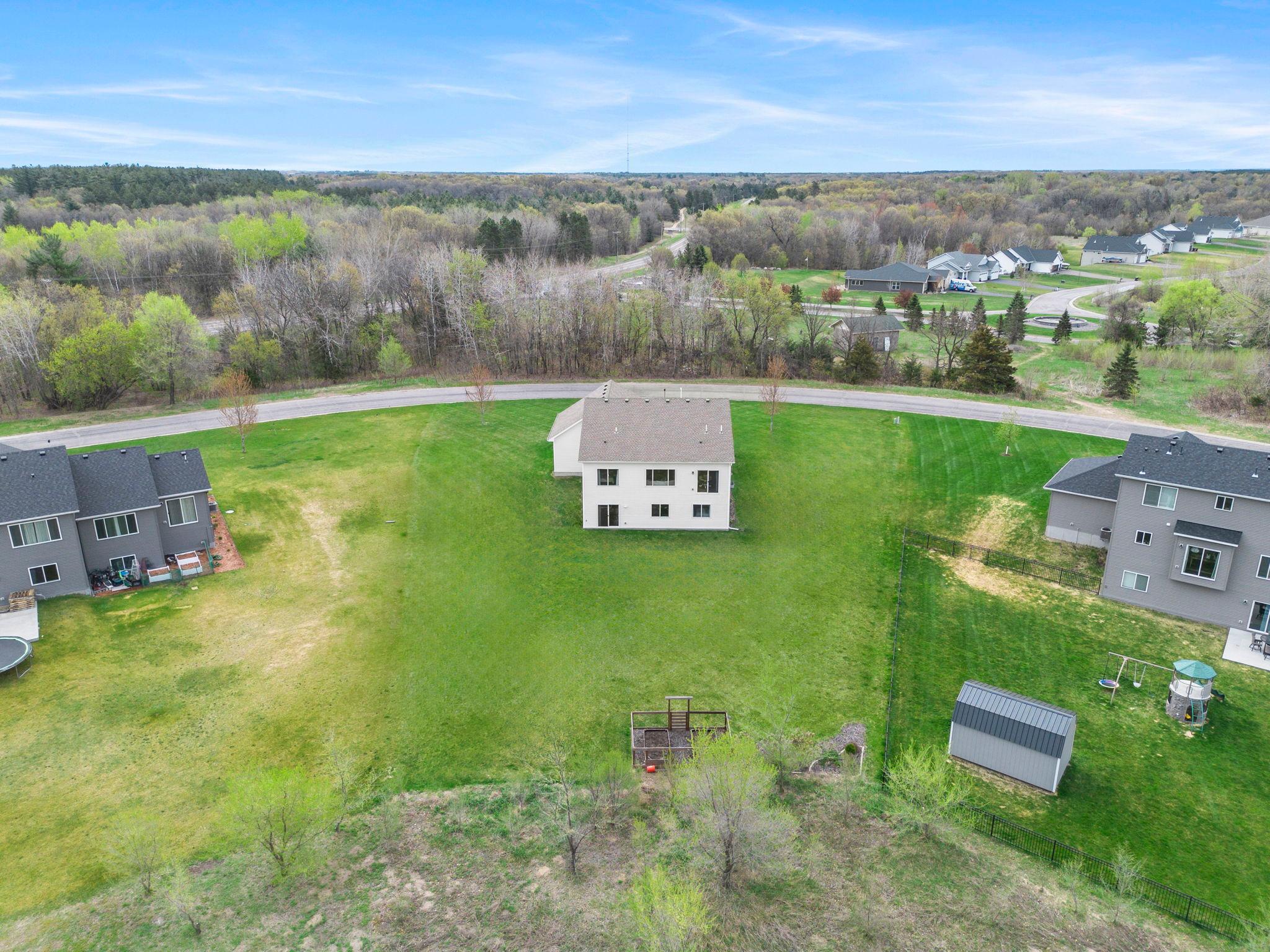 With no house across the street, you get views of trees from both front and backyard in this home.