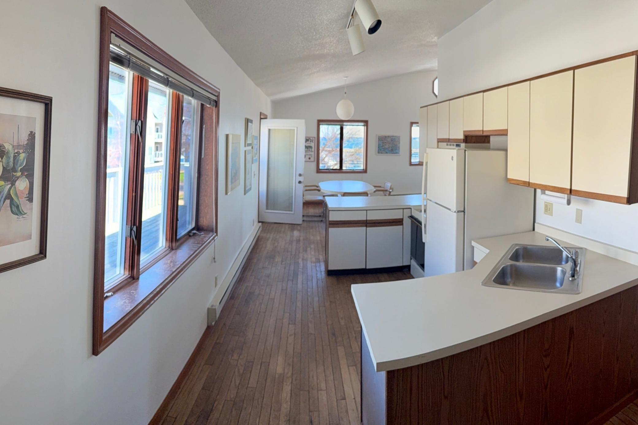 Kitchen leading to deck and dining area