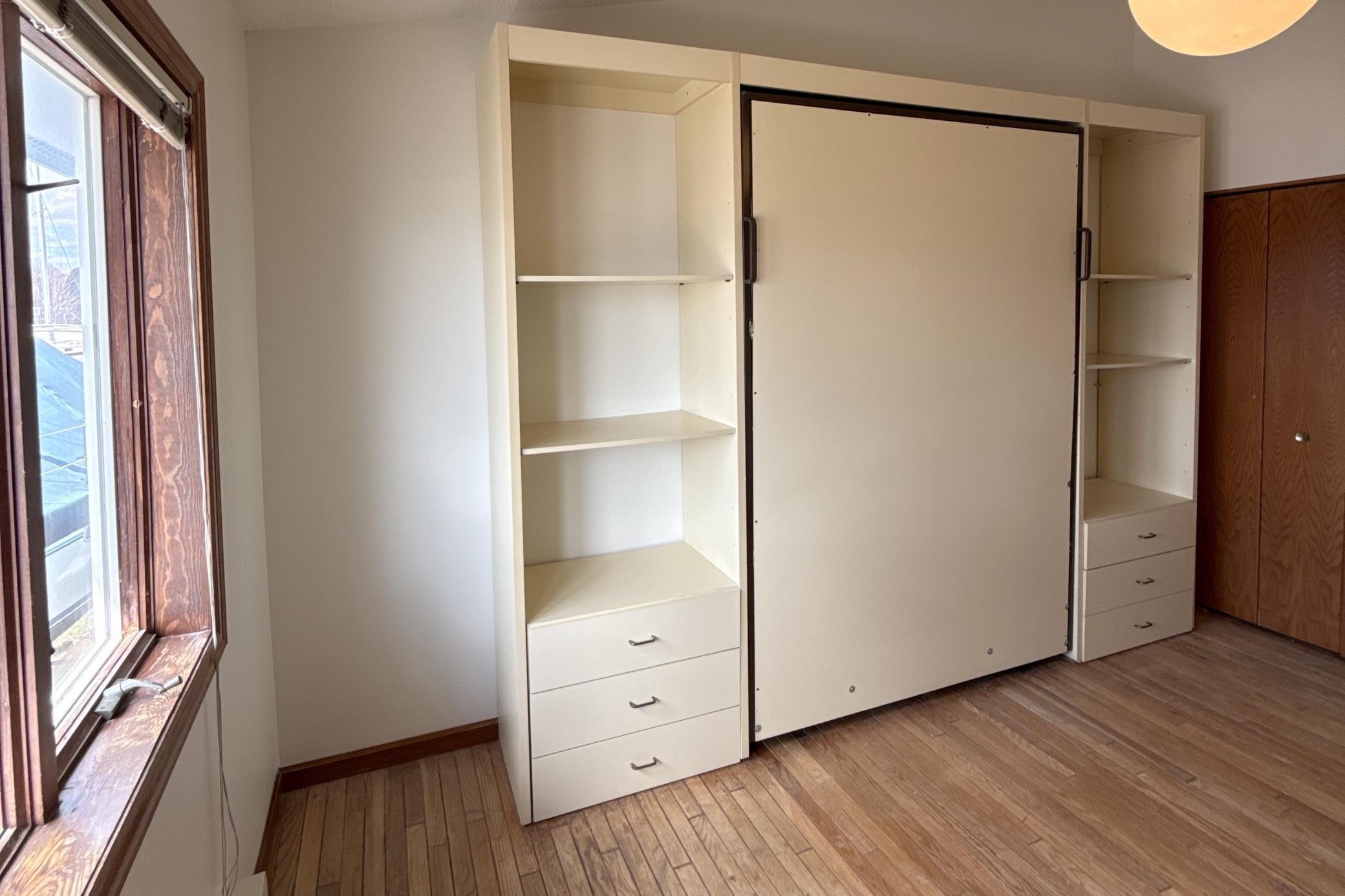 Primary bedroom with Murphy bed
