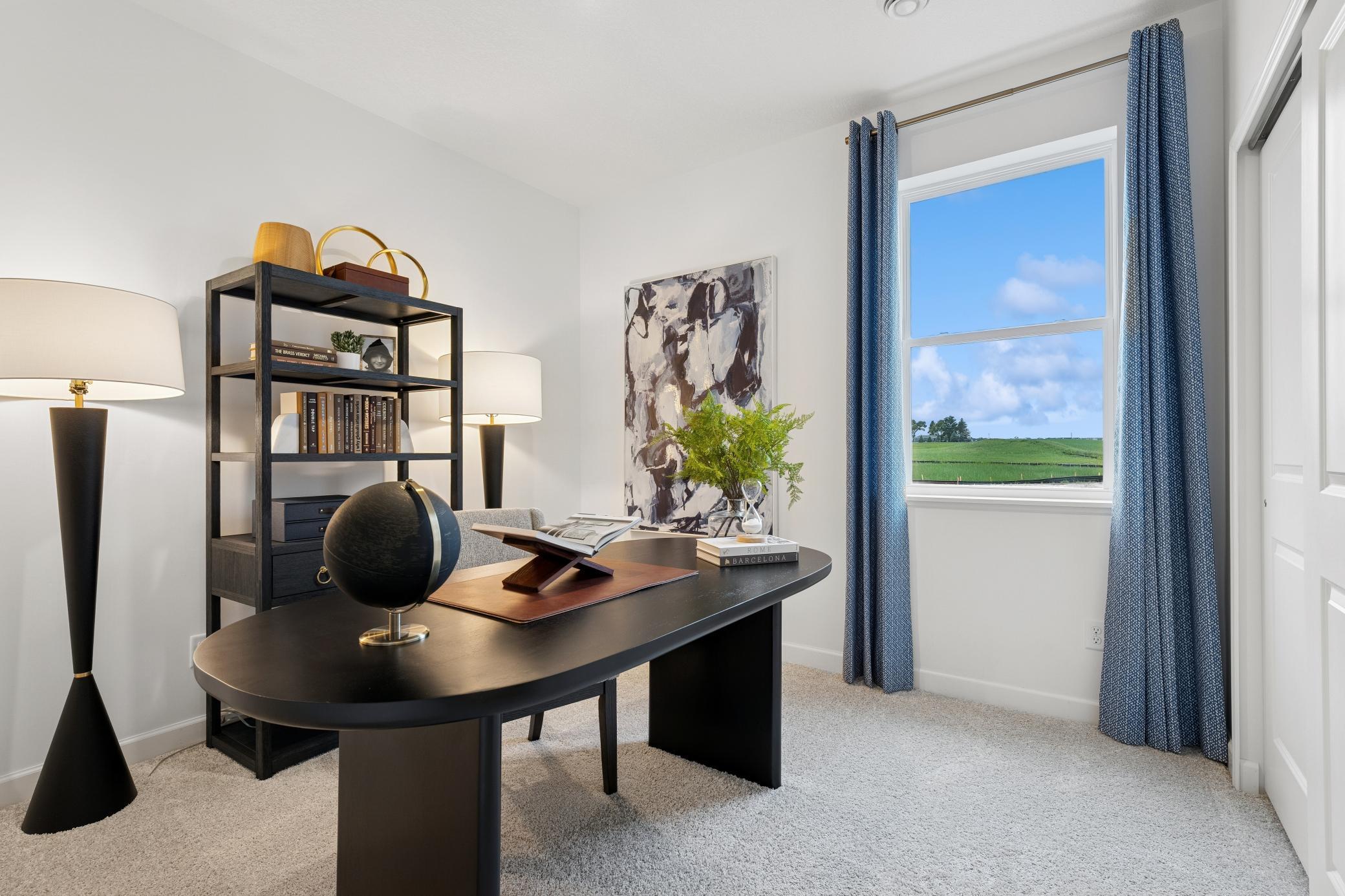 Main level bedroom can be utilized in a variety of ways, such as transforming it into a home office!