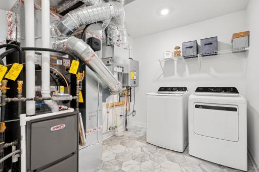 Centrally located on the upper level, along with the four bedrooms, this laundry room is sure to provide the ultimate convenience.
