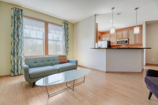 Another view of living room - beautiful new flooring on mail level