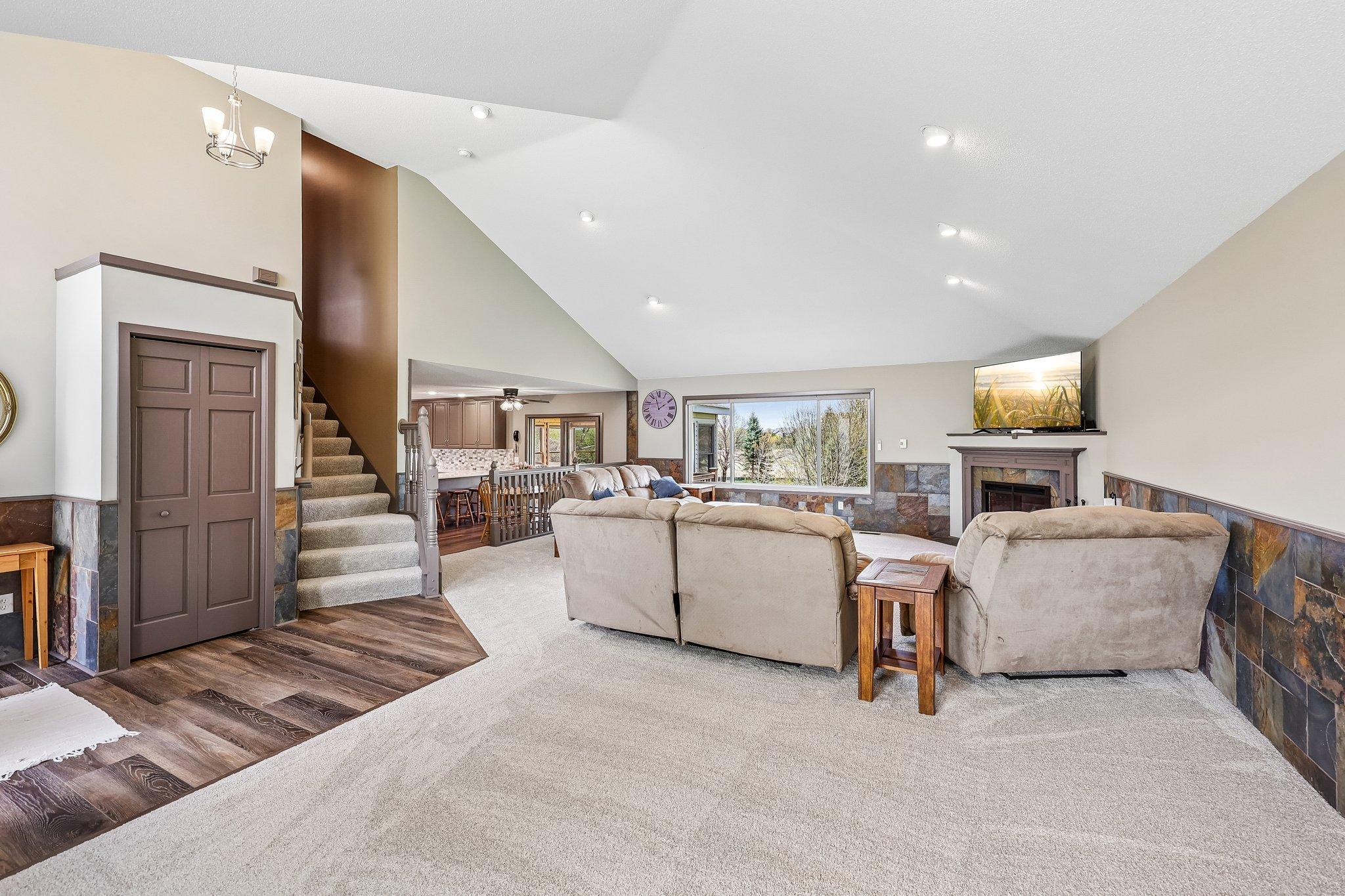 Walk in to a gorgeous Living Room with stone work, new carpet, flooring and fresh trim!