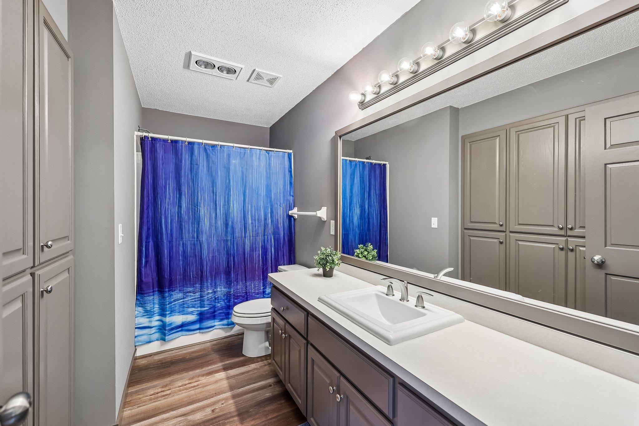 Upper level full bath. Look at all of the storage!