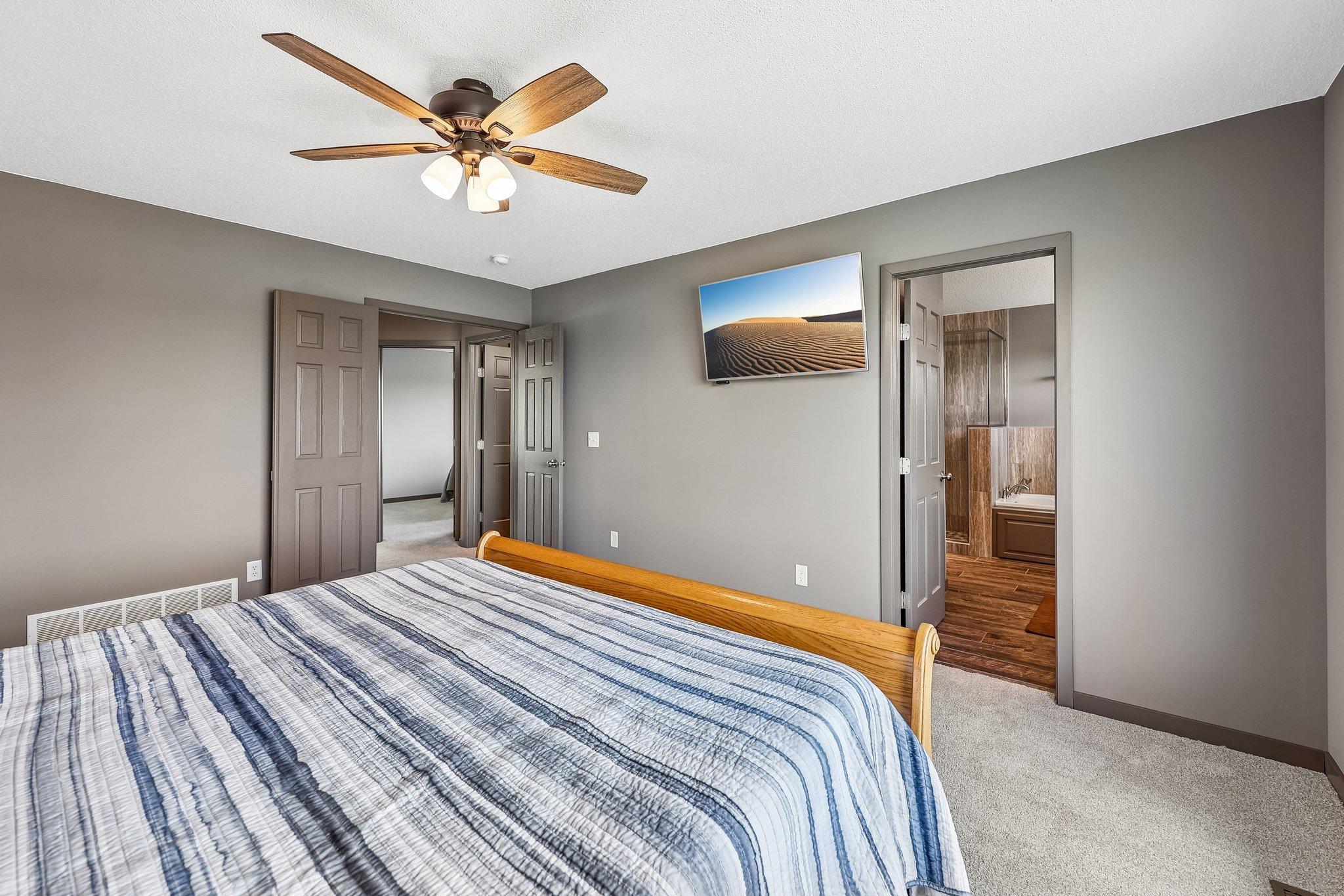 Owners Suite to the Hallway and Owners Bath.