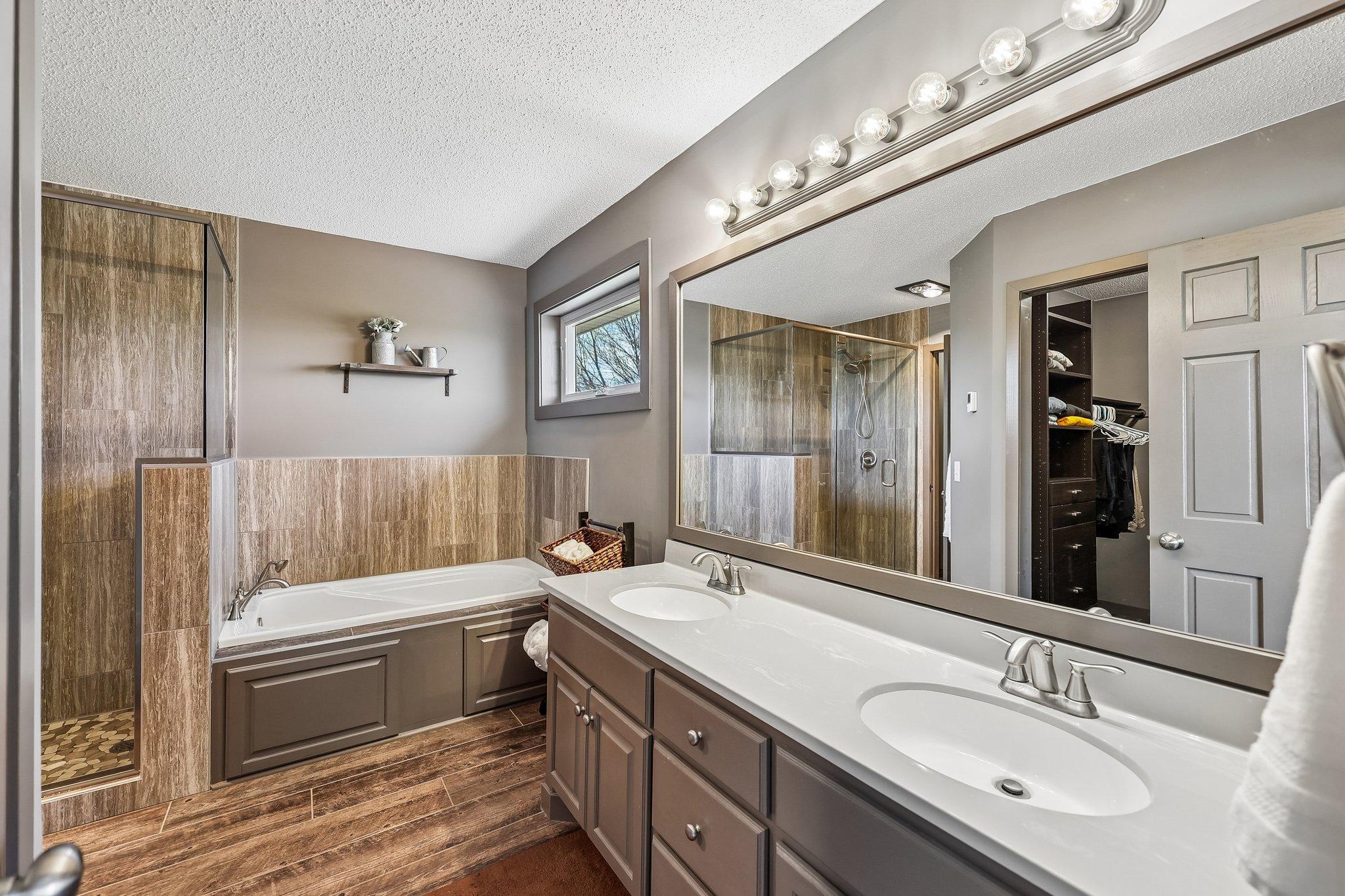 Completely renovated Owners Bath with custom shower doors, dual sinks, jetted tub.