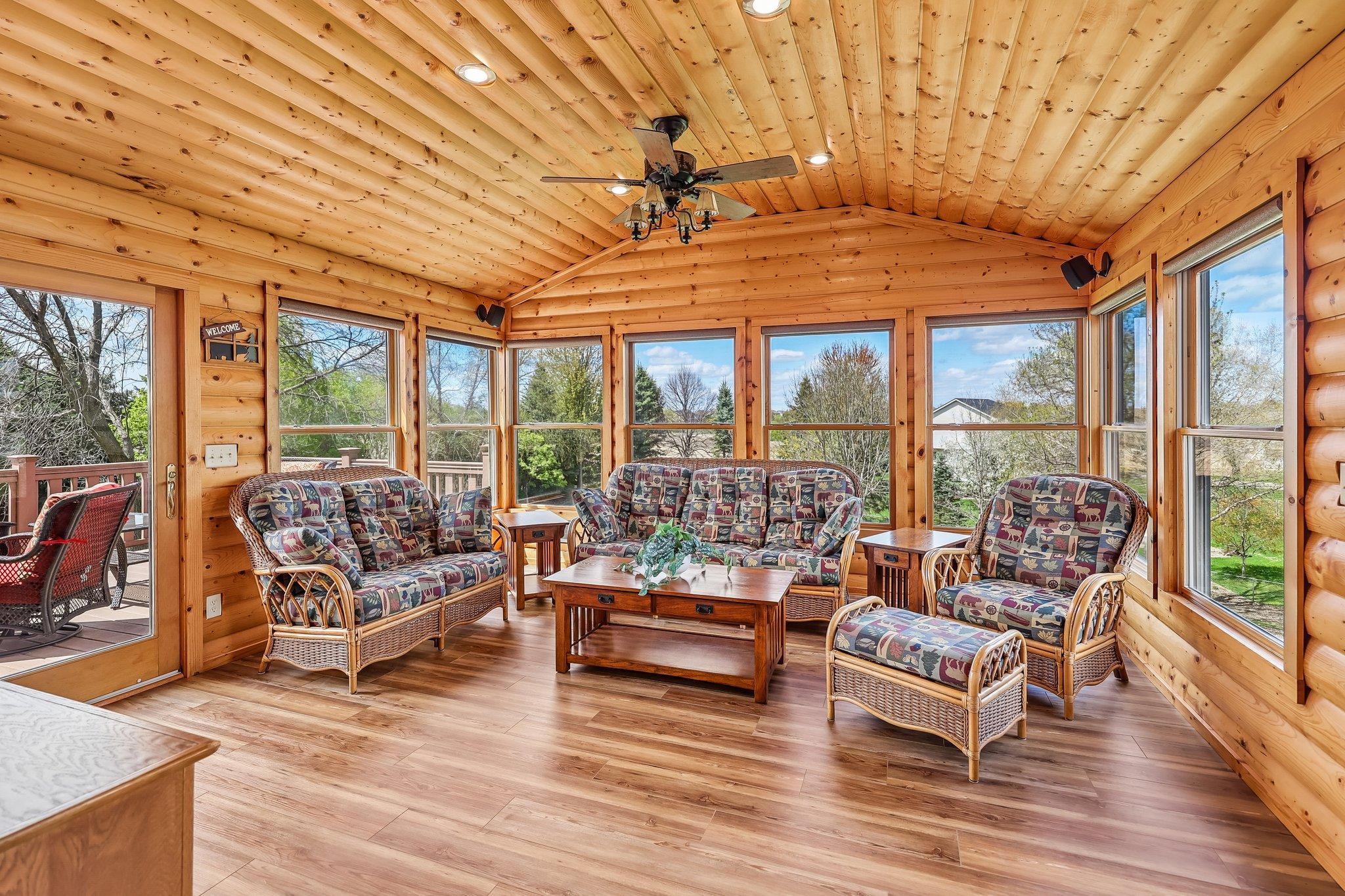Gorgeous wooded 4 season porch.