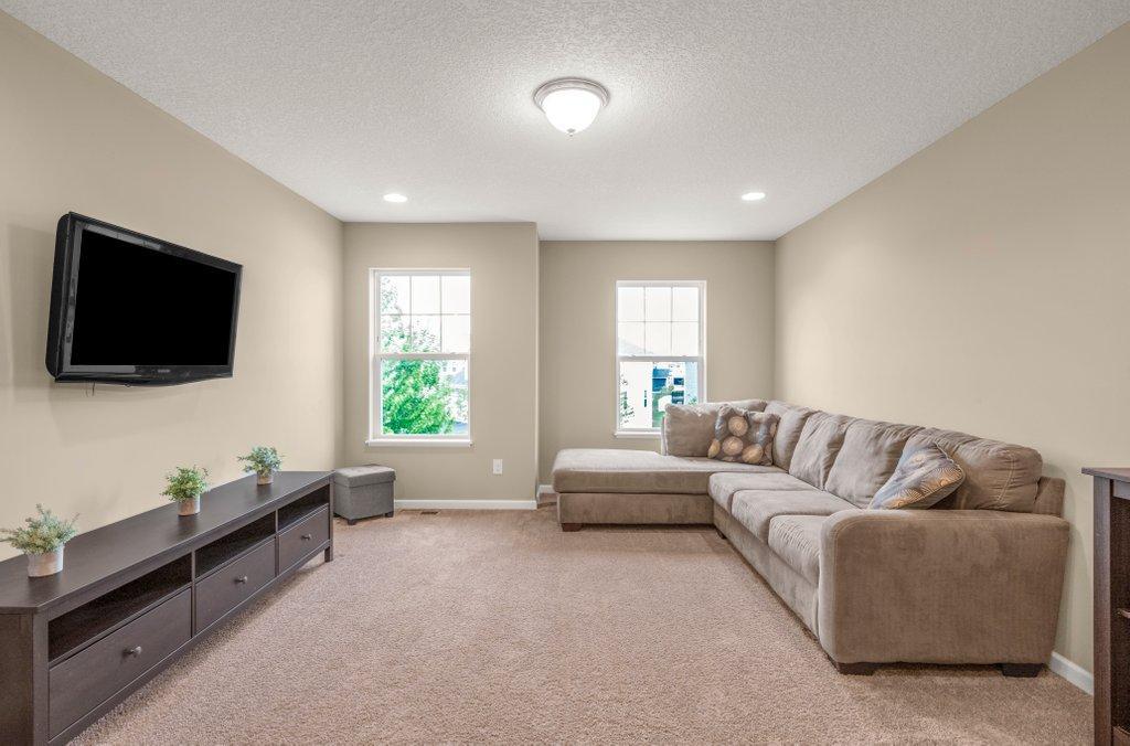Upper level loft area offer another gathering space allowing time to finish the lower level walkout when and how you choose