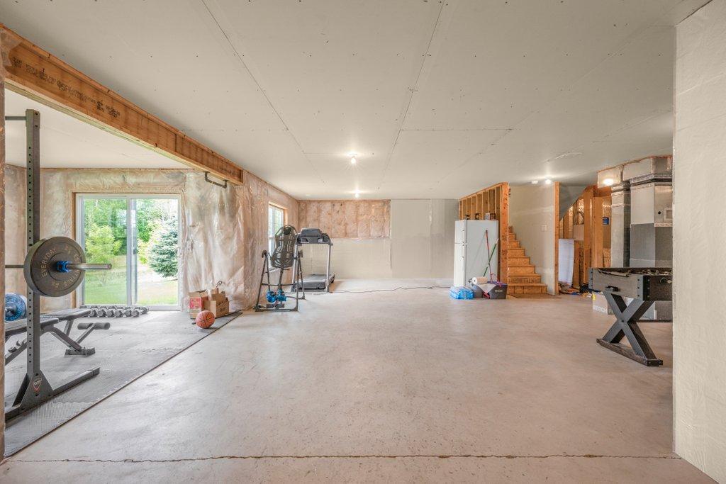 The sun-filled lower level is ready for your ideas and finishing touches