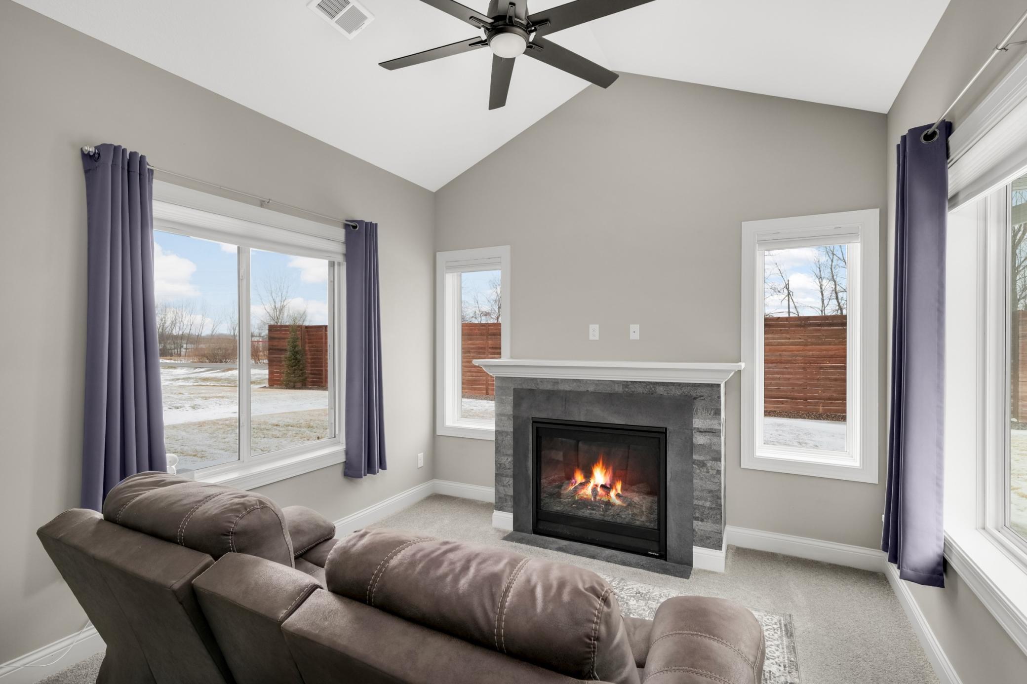 Cozy sun room bump out with gas fireplace