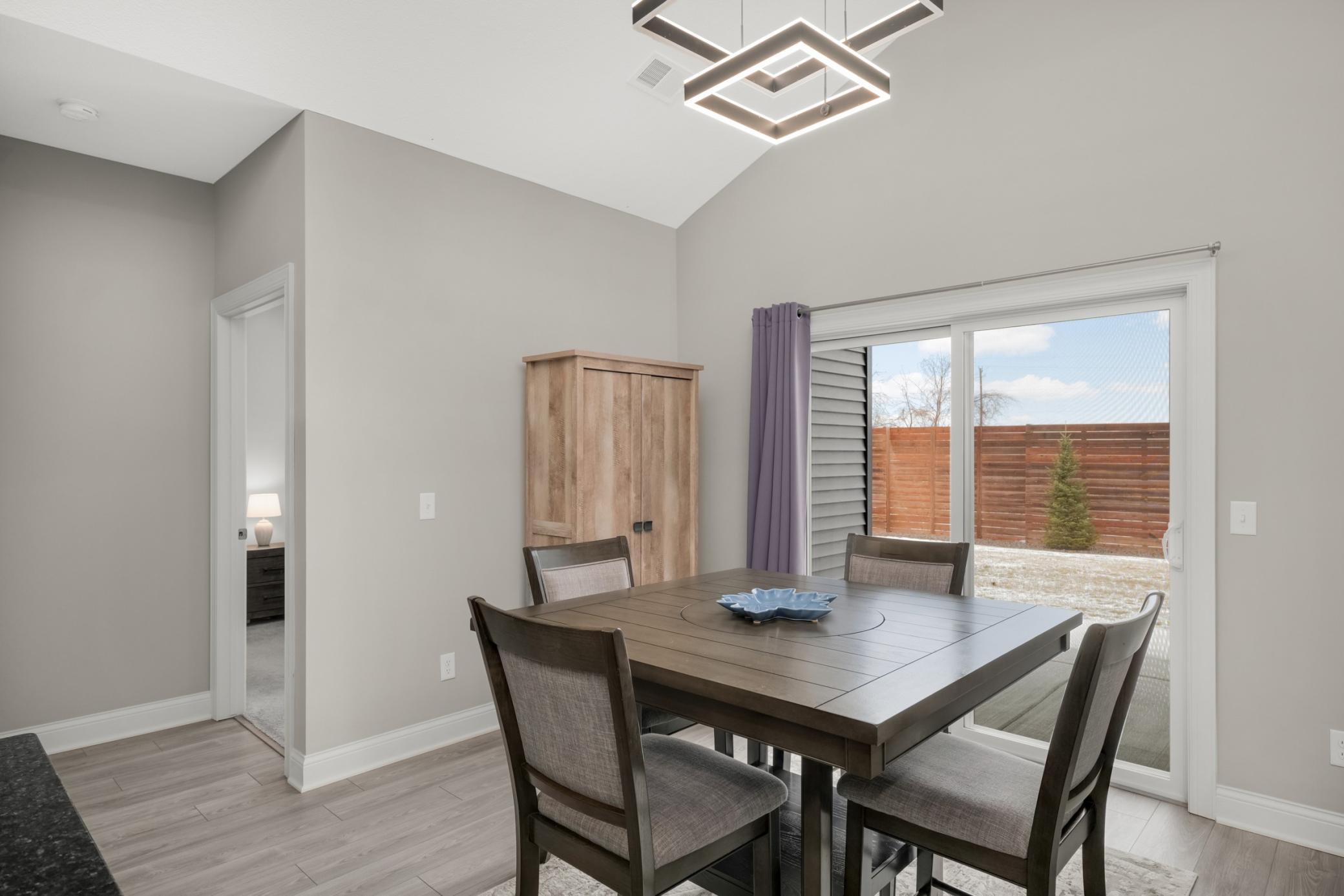 Dining area with walkout to the private patio