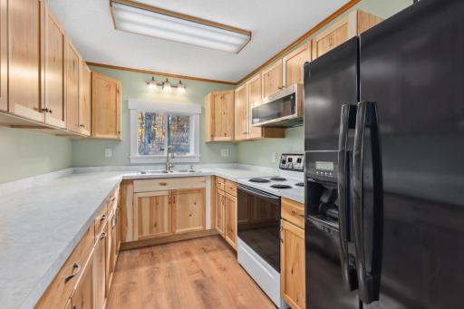 Updated kitchen with great storage and counter workspace. Imagine cabin mornings with pancakes!