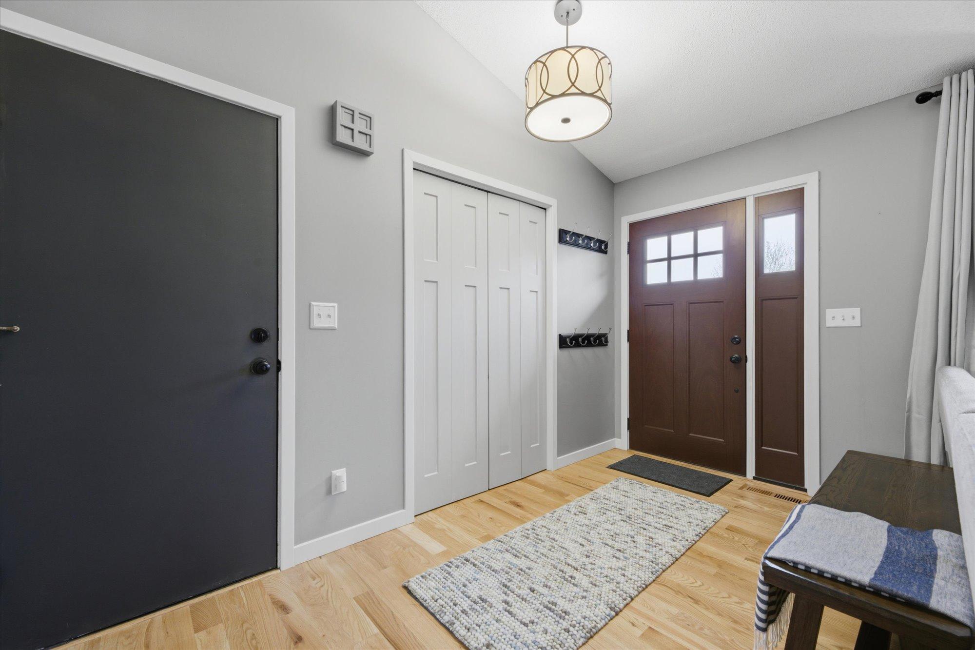 warm appealing entry with new door.