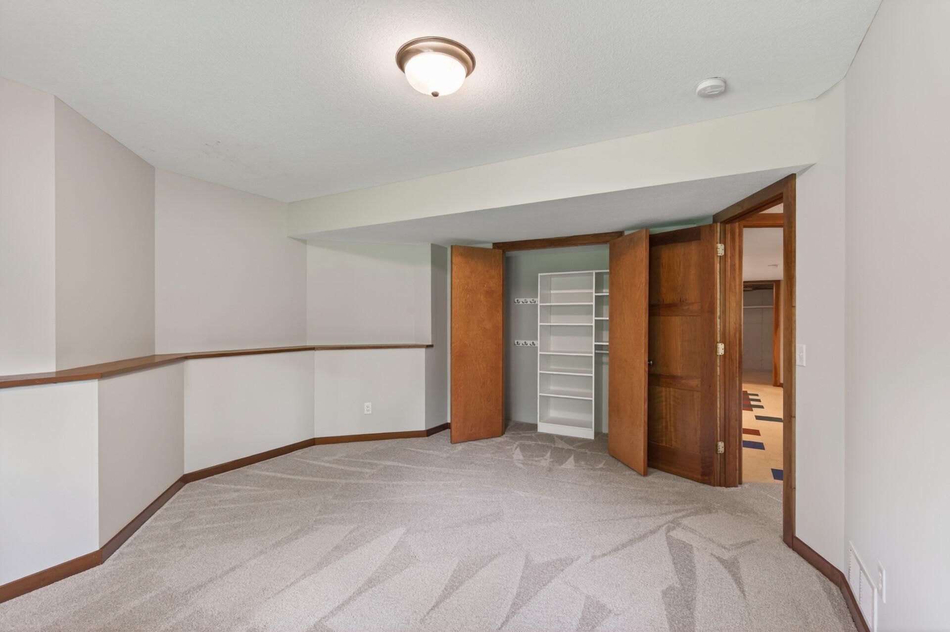 4th Bedroom view of closet with built-in organization.