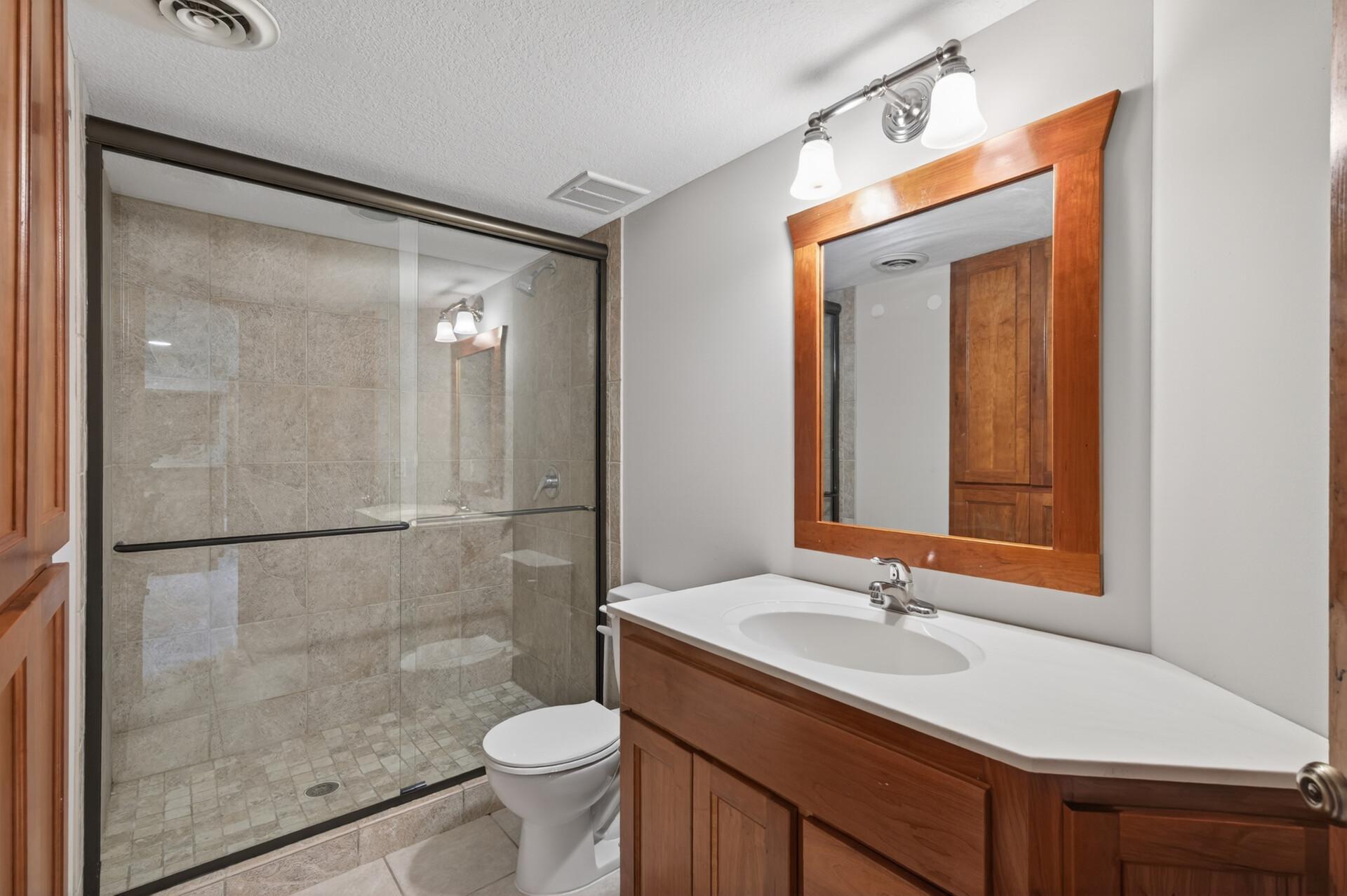 Lower level 3/4 bath will fully tiled shower.