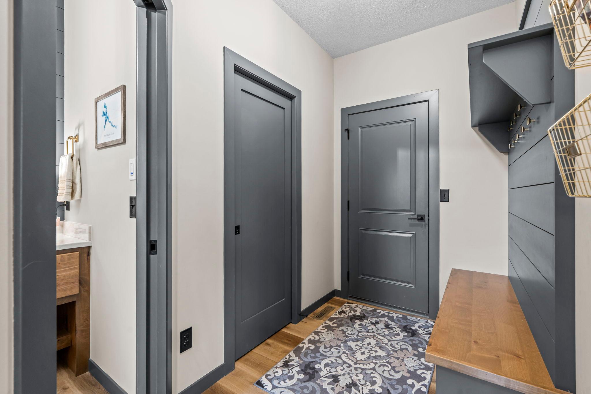 Step inside from the garage into a functional mudroom, complete with a built-in bench and hooks