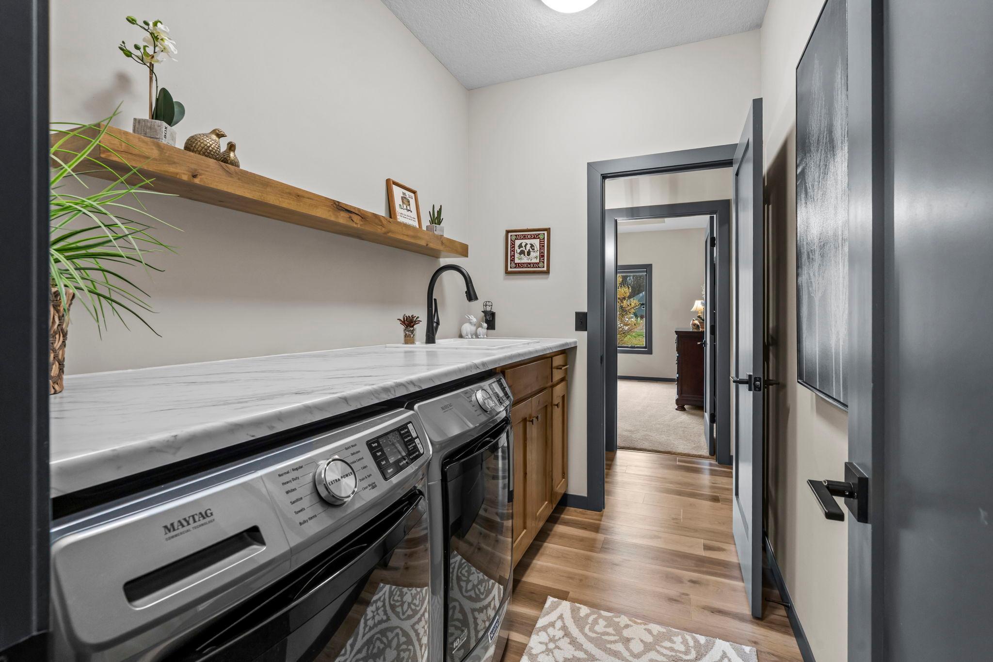 Enjoy the convenience of a main-level laundry room complete with a handy sink