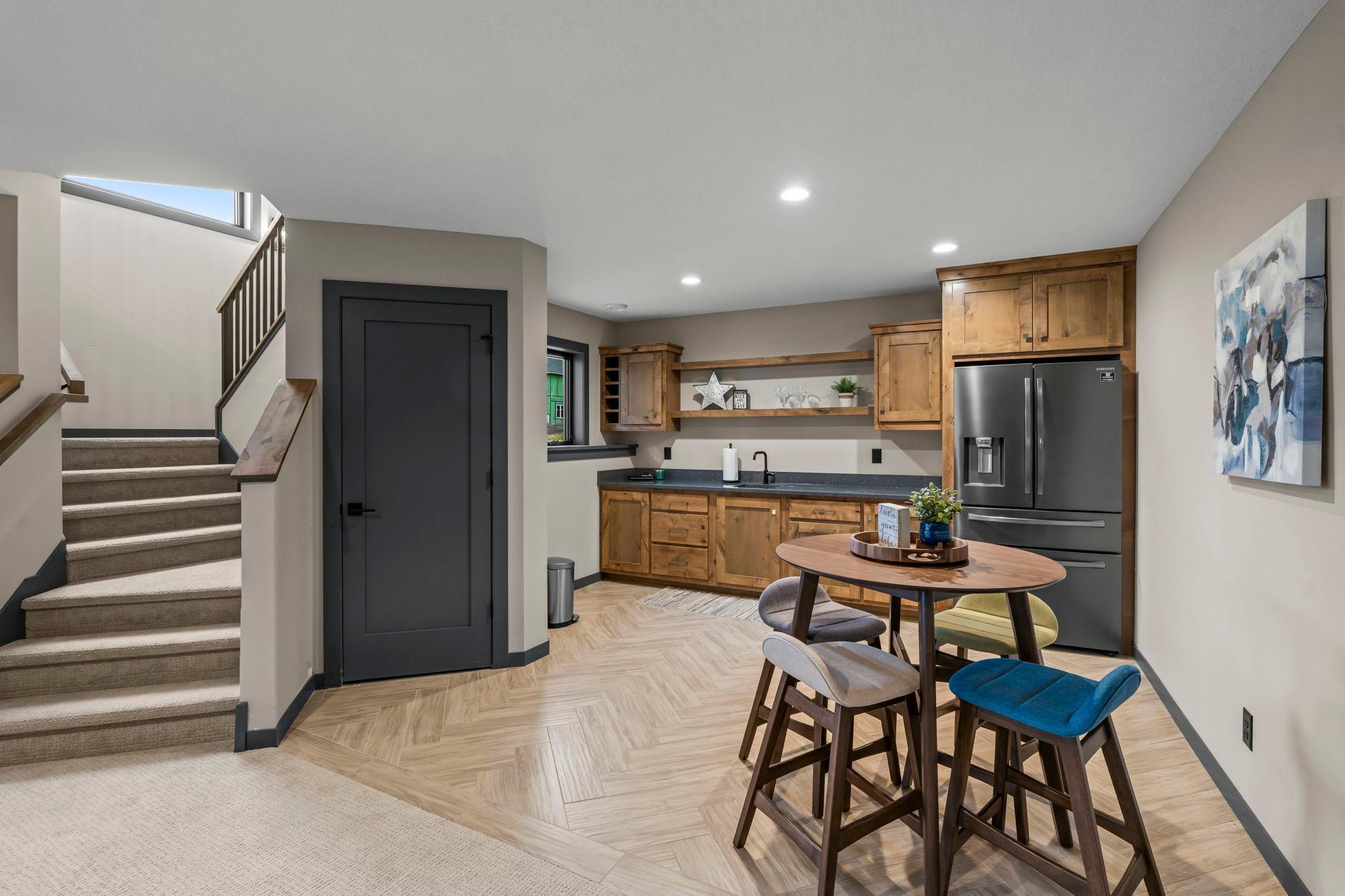 The lower-level kitchenette provides a fantastic space for additional living and entertaining