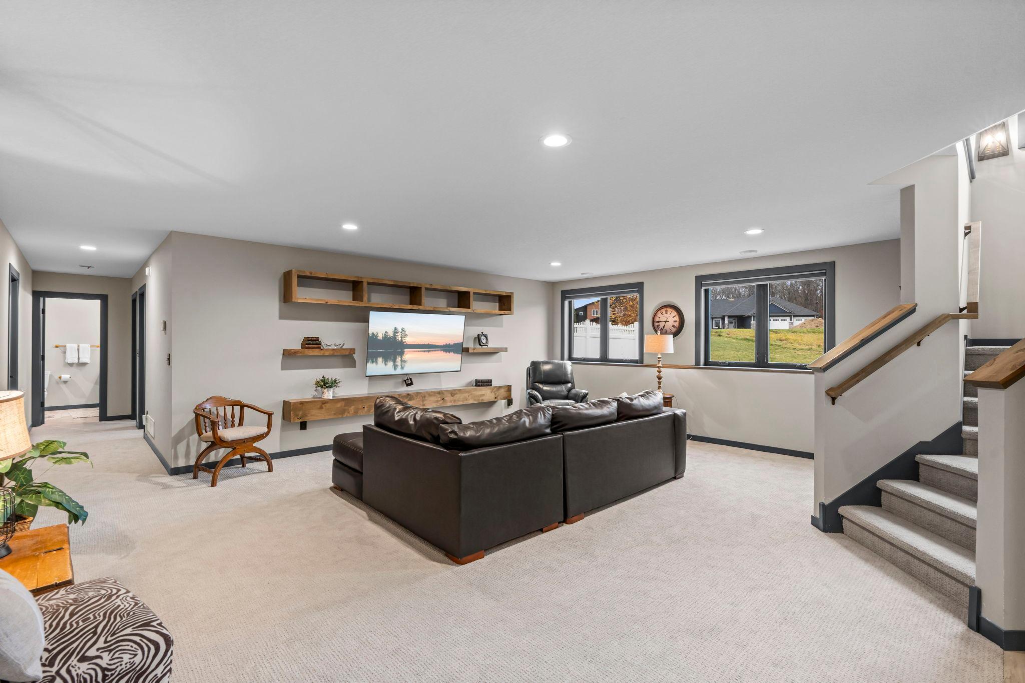 Spacious lower level offers a family room, kitchenette/wet-bar, 2 bedrooms, a full bath & storage space