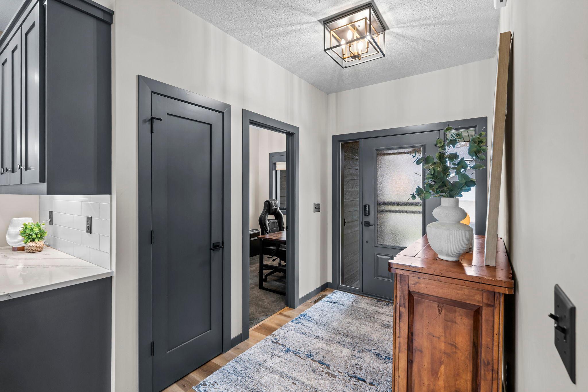 Just off the foyer, find a flexible bedroom/office space and a handy storage closet