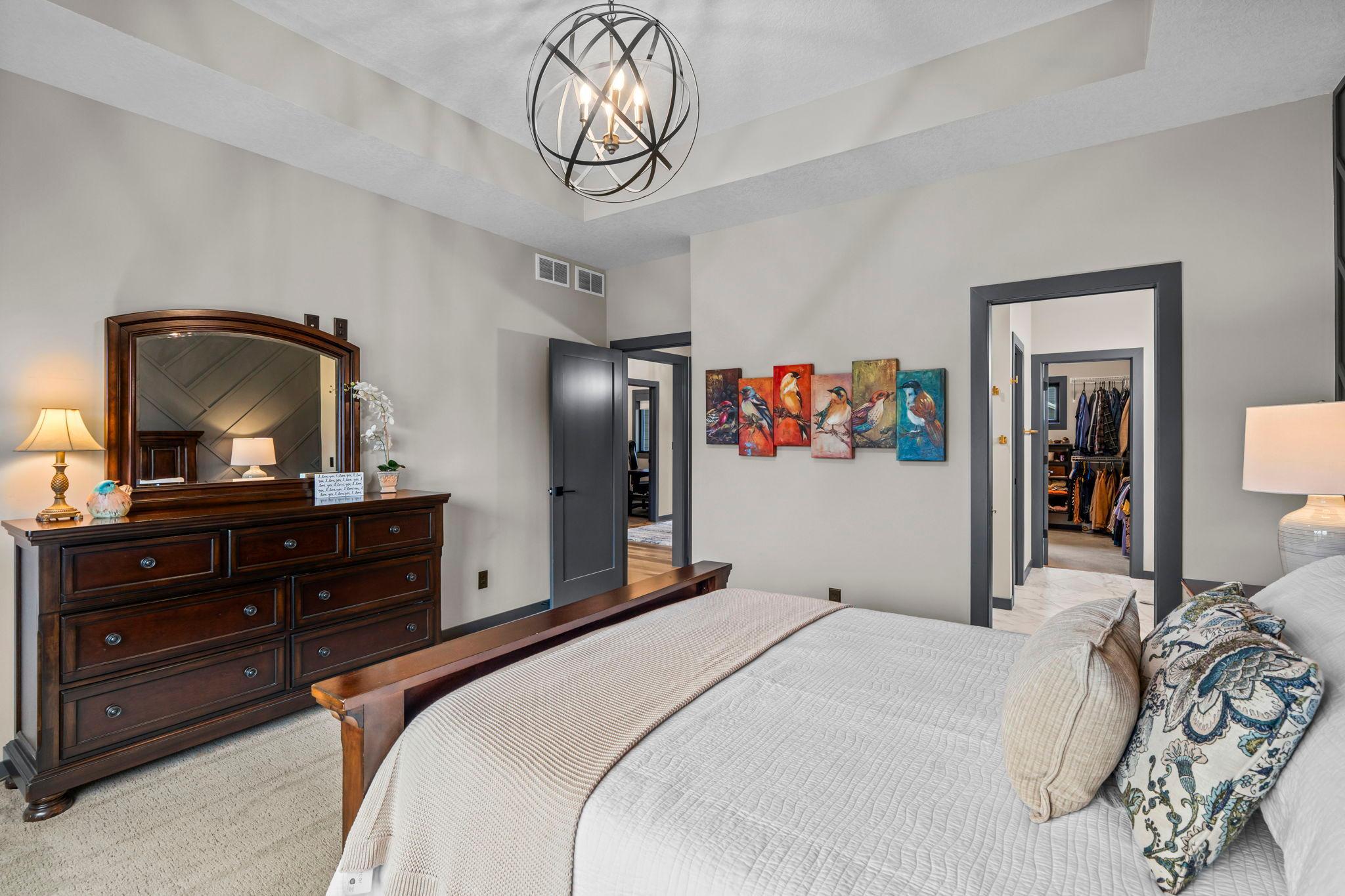 Primary bedroom connects to a large walk-in closet & ensuite bath