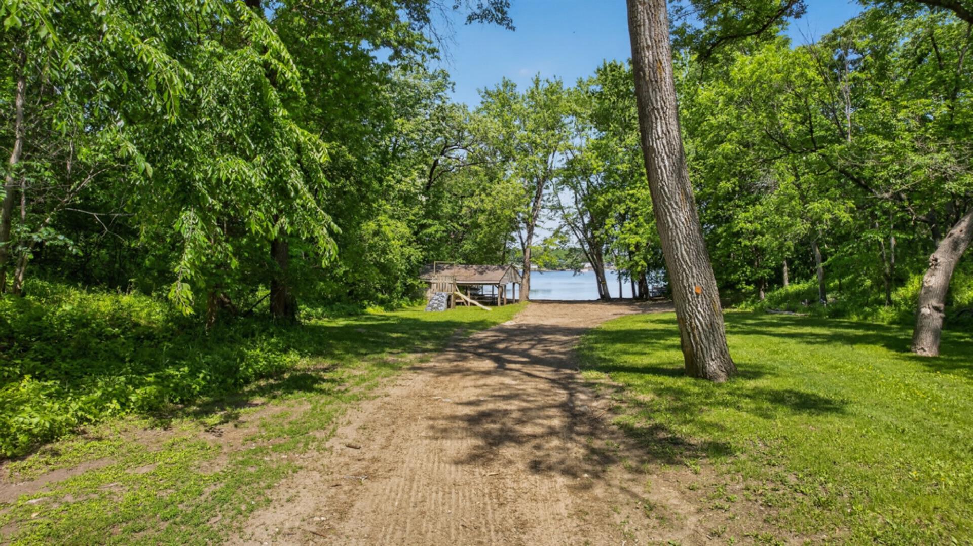 The property includes shared ownership with Harbo Hills residents of approximately 2.75 acres along Lake Zumbro. Includes; waterfront area with approximately 75 feet of beachfront, a picnic shelter, and space for storing boats/watercraft.