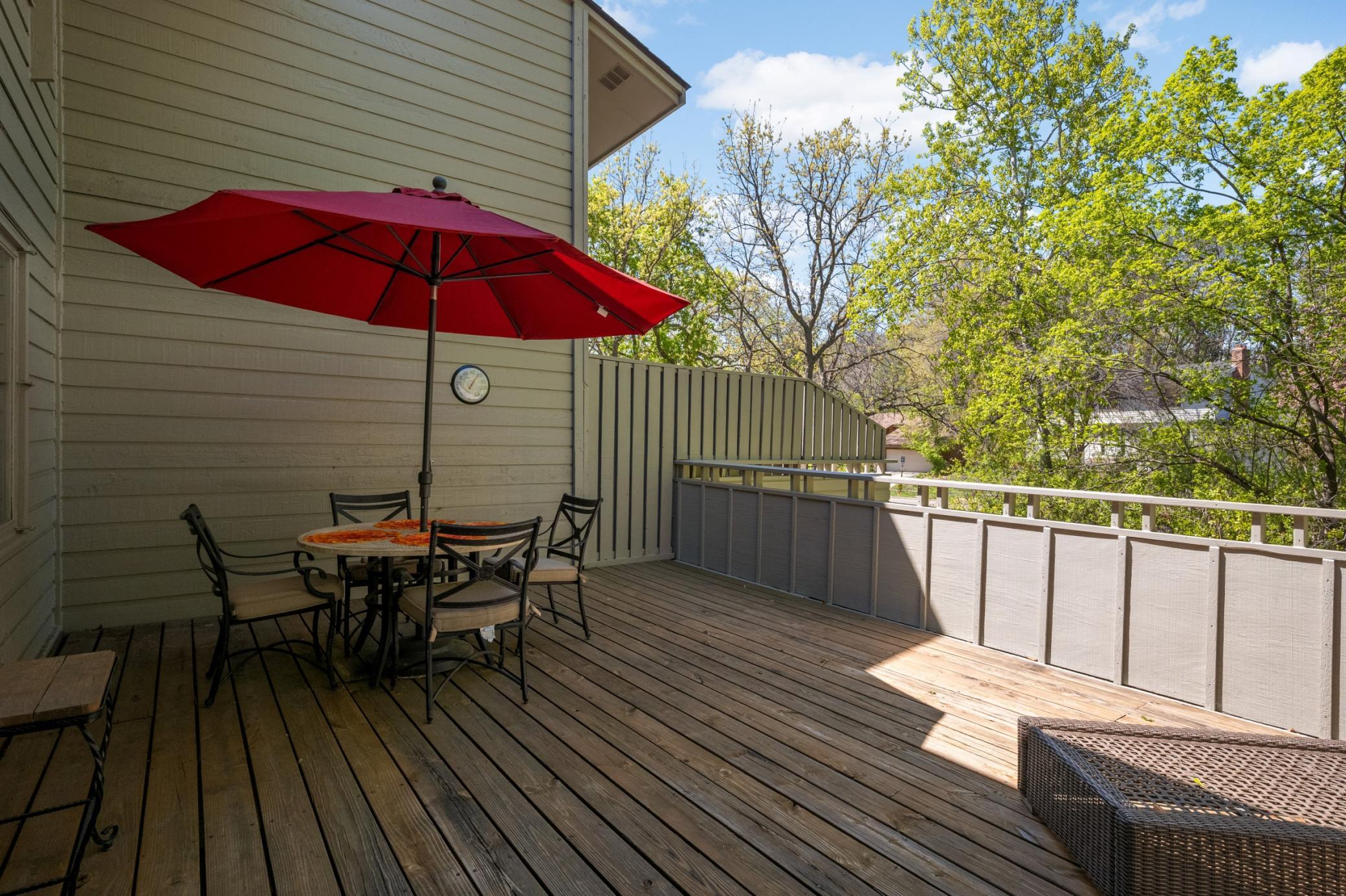 The spacious deck offers privacy and a place to relax and entertain