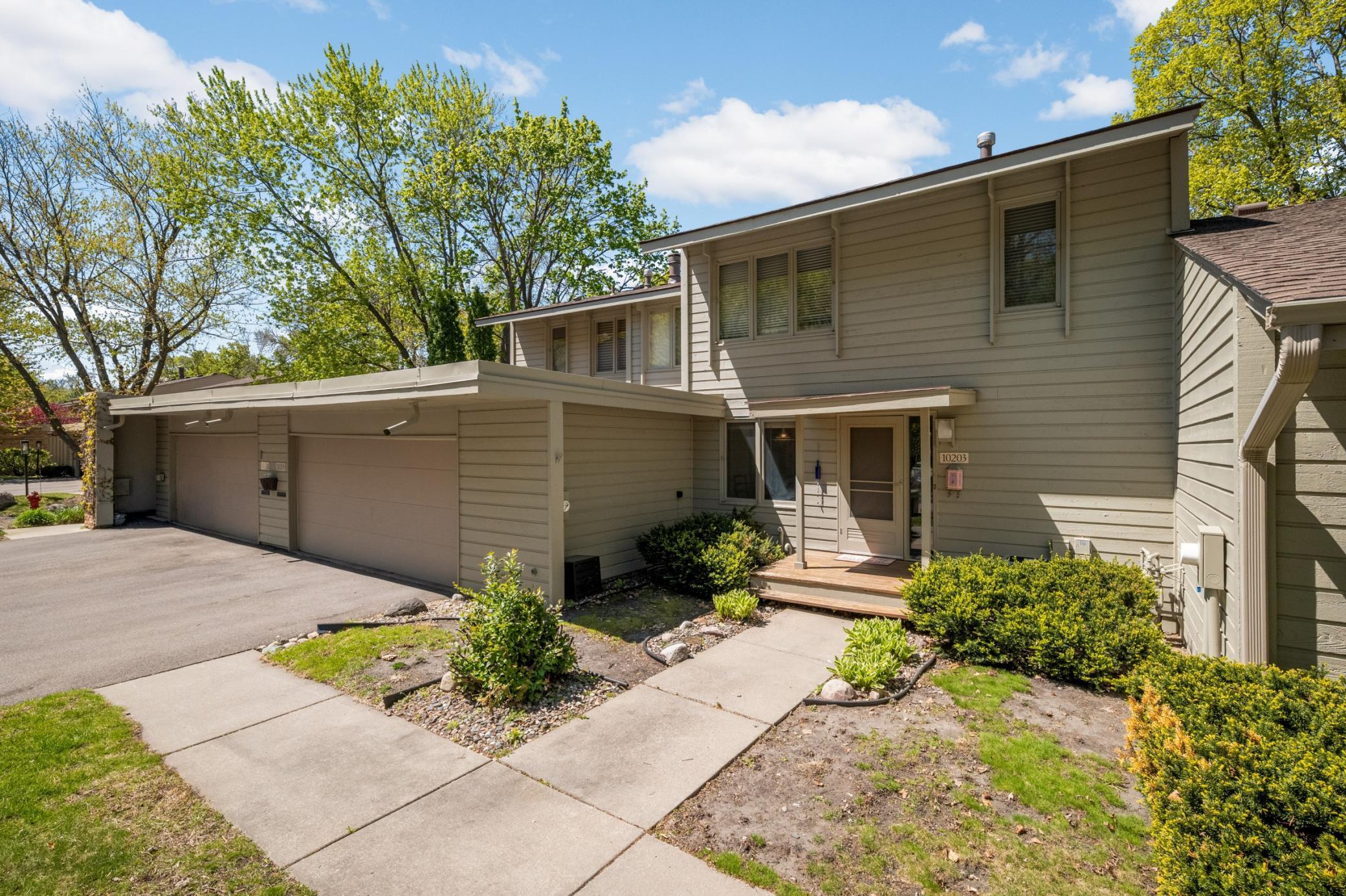 The exterior features a newer roof and recently painted cedar siding.