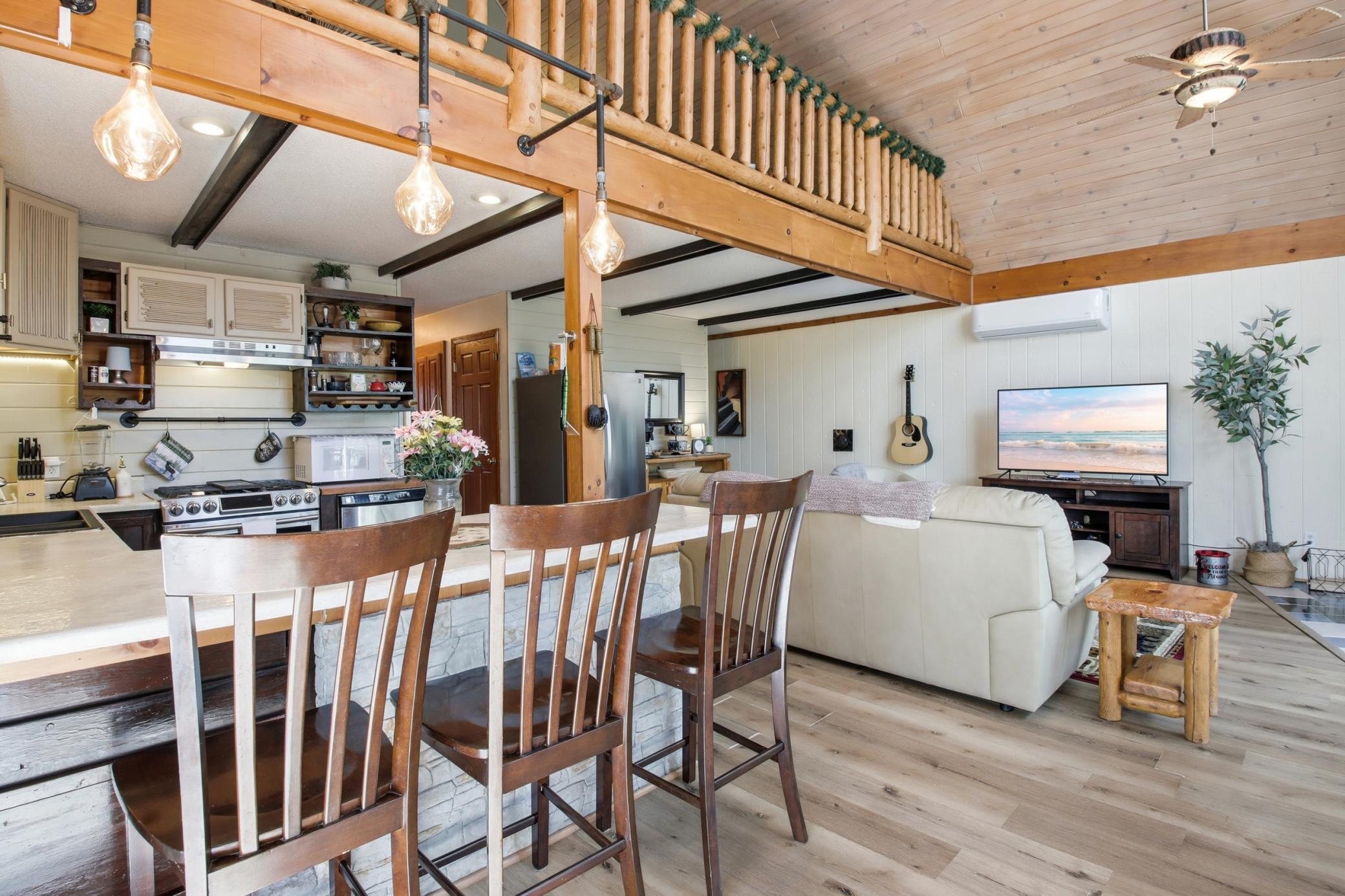 The breakfast bar extends seating options or remove the chairs and utilize as a buffet serving area when entertaining.