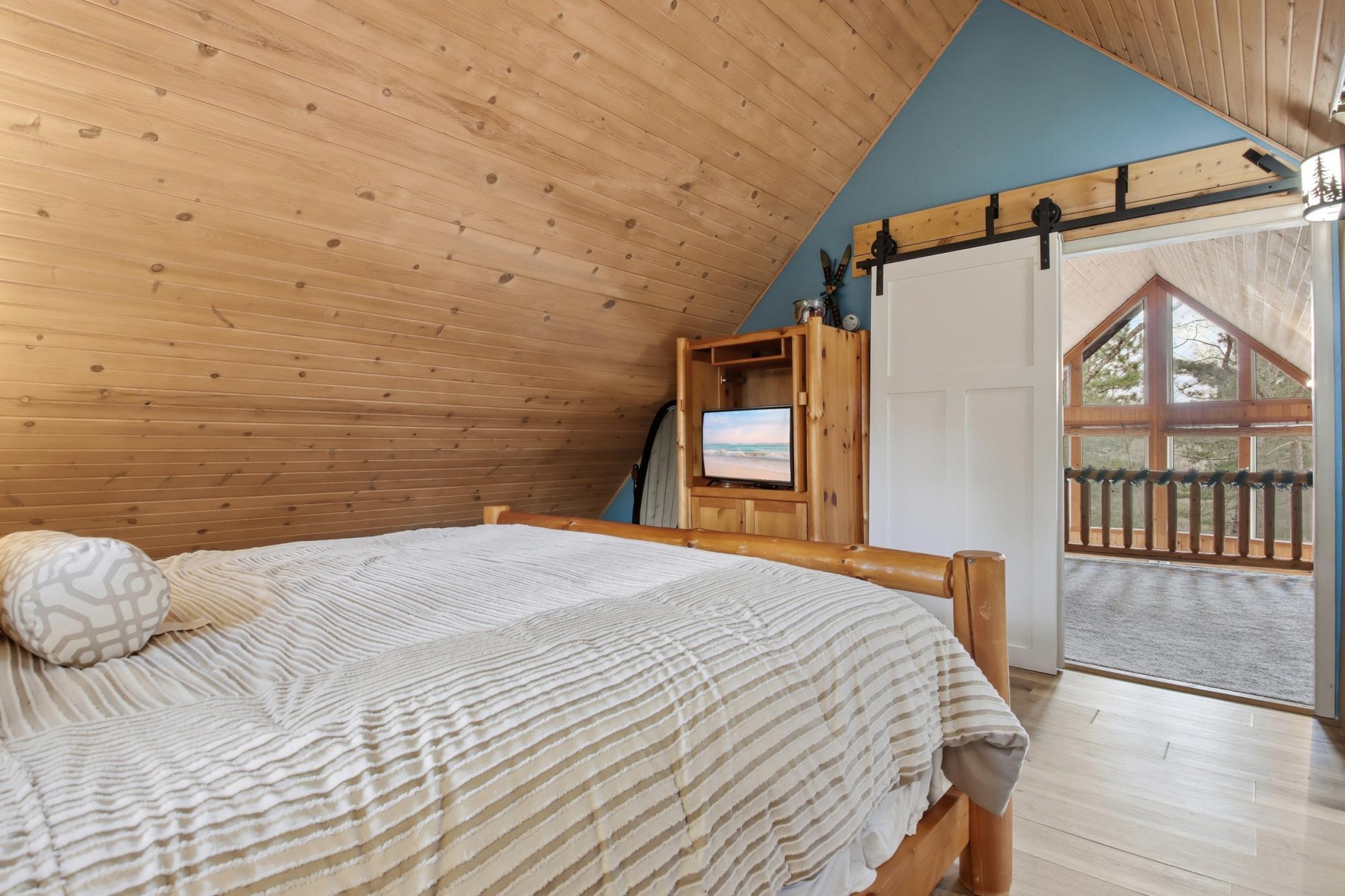 The tongue and groove ceilings share the Northwoods theme here.