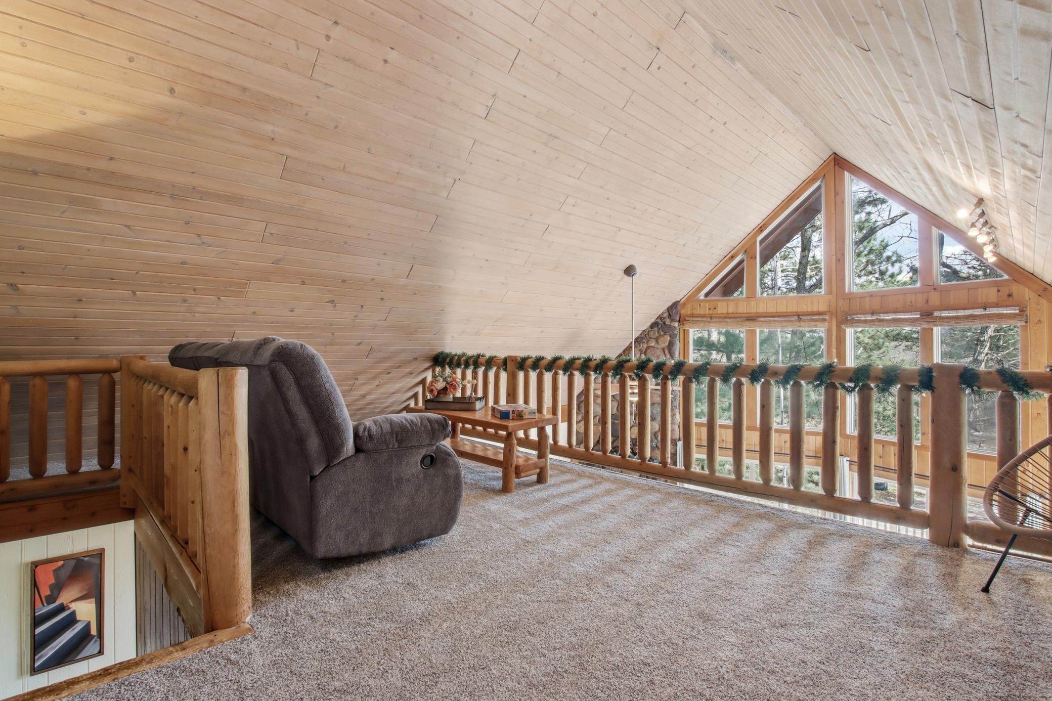 The upper level offers an additional living space or extension of the owners suite.