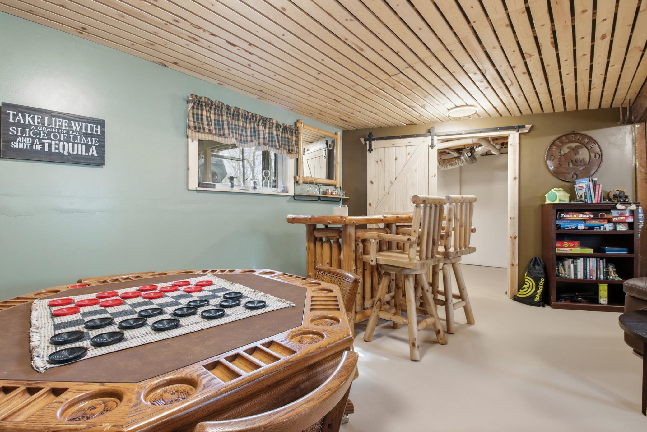 The wood theme carries throughout the home. Barn doors close off the laundry area.