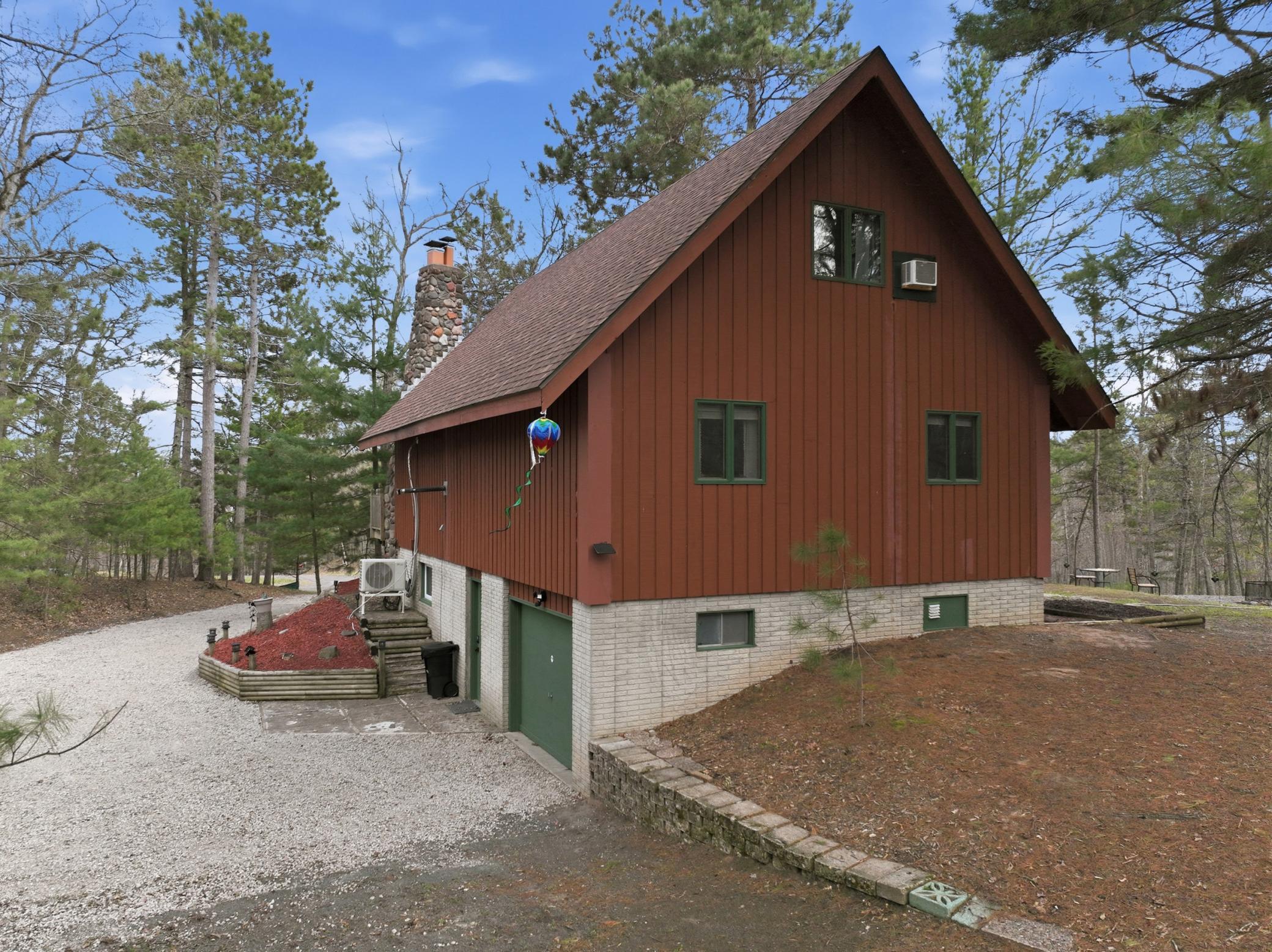 Driveway leads to the tuckunder garage.