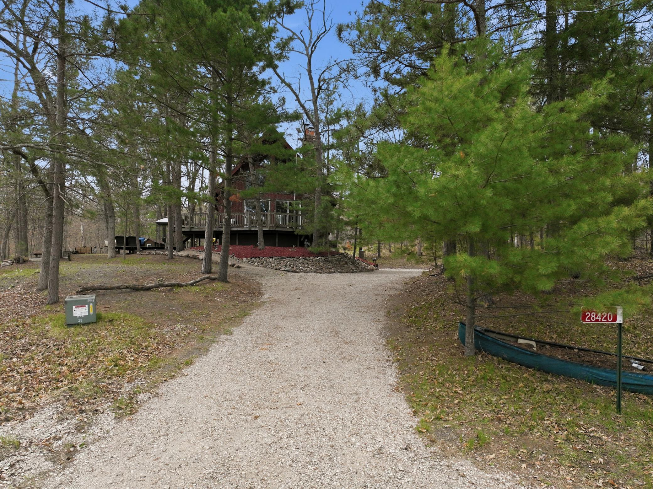 A top dress of gravel was added to the driveway. Home sets off the road.