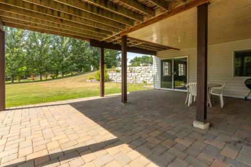 Additional shady outdoor living space on the paver patio