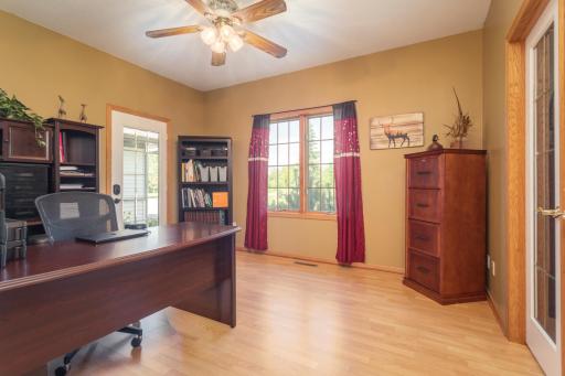 A bright home office offers a comfortable setting for work, hobbies, or quiet reading