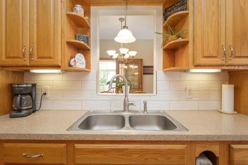 Enjoy a cheerful view from the kitchen sink and convenient everyday workspace