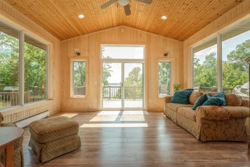 Surrounded by windows, the sunroom is a peaceful place to relax and enjoy the view
