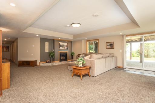 Spacious walkout lower-level family room designed for entertaining family and friends