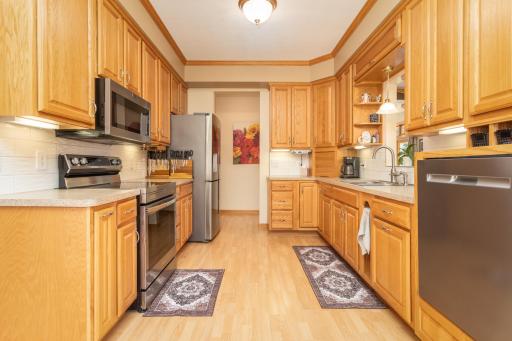 The spacious kitchen offers abundant cabinetry and plenty of room to prepare and gather
