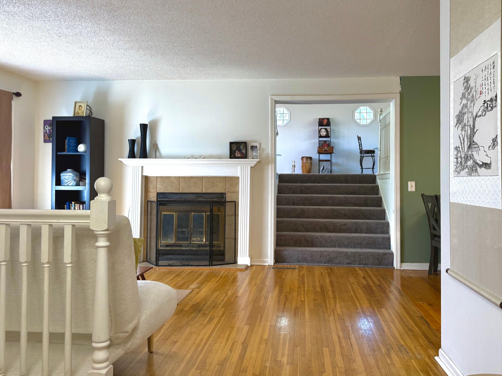 Main Level Stairs to Bonus Room.JPEG