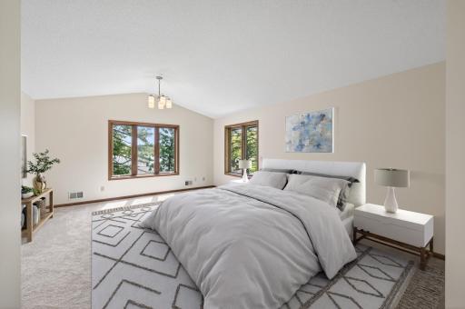 Owner's suite has his and hers closet space.