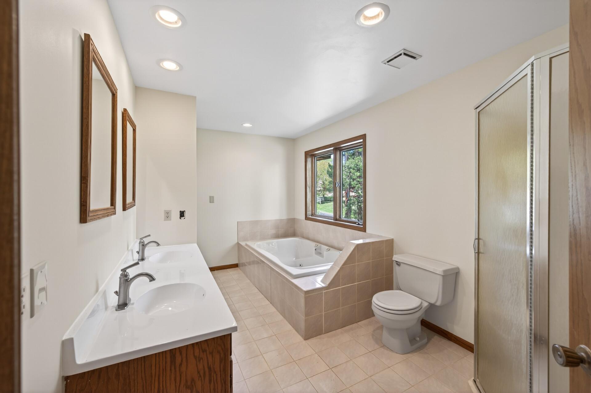 Upper level bath has separate shower and jet tub.